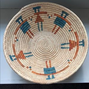 woven basket with rust and blue accents